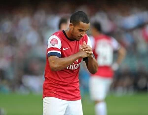 Images Dated 29th July 2012: Theo Walcott's Respectful Chinese Goal Celebration: Arsenal's First in Kitchee FC Friendly, 2012