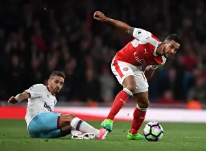 Arsenal V West Ham United 2016-17 Prints: Theo Walcott's Sneaky Move: Outsmarting Manuel Lanzini in the Arsenal vs
