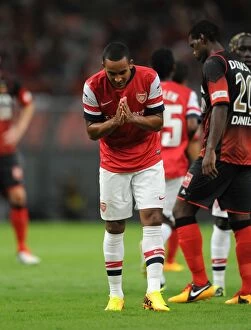 Nagoya Grampus v Arsenal 2013-14 Collection: Theo Walcott's Thrilling Goal: Arsenal's Victory over Nagoya Grampus in the 2013 Toyota Tour
