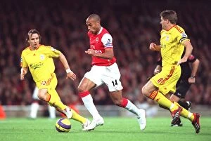 Arsenal v Liverpool 2006-07 Collection: Thierry Henry (Arsenal) Bolo Zenden and Steven Garrard (Liverpool)