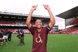 Images Dated 11th May 2006: Thierry Henry (Arsenal) celebrates as news of the Totteham score reaches the ground