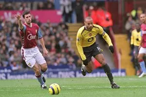 Aston Villa v Arsenal 2005-6 Collection: Thierry Henry (Arsenal) Mark Delaney (Aston Villa). Aston Villa 0: 0 Arsenal