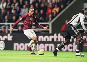Newcastle United v Arsenal 2005-6 Gallery: Thierry Henry (Arsenal) Titus Bramble (Newcastle United)