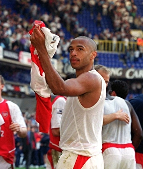 Thierry Henry celebrates pointing to his Badge. Tottenham Hotspur v Arsenal