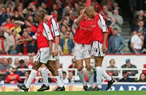 Thierry Henry is congratulated by Ray Parlour on scoring his 2nd Arsenal goal