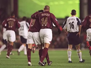 Thierry Henry congratulates Jose Reyes on the pass that set up Dennis Bergkamps goal