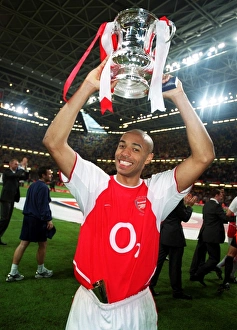 Thierry Henry with the FA Cup after the match