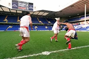 Thierry Henry runs off with the inflatable trophy followed by Robert Pires