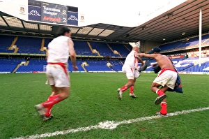 Thierry Henry runs off with the inflatable trophy followed by Robert Pires Thierry Henry runs off with the inflatable trophy followed by Robert Pires