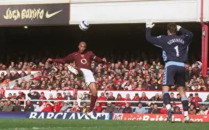 Thierry Henry scores his 1st, Arsenals 2nd goal under pressure from Thomas Sorensen