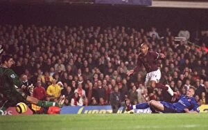 Henry Thierry Collection: Thierry Henry scores his 3rd goal Arsenals 6th under pressure from David Wheater