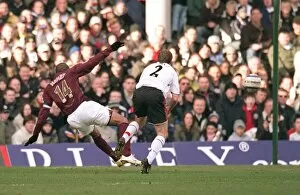 Images Dated 4th March 2006: Thierry Henry scores Arsenals 1st goal under pressure from Moritz Volz (Fulham)