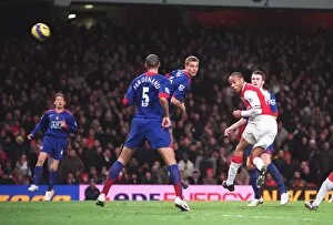 Images Dated 21st January 2007: Thierry Henry scores Arsenals 2nd goal under pressure from Nemanja Vidic (Man Utd)