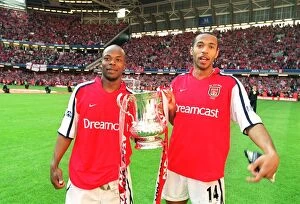 Arsenal v Chelsea FA Cup Final Collection: Thierry Henry and Sylvain Wiltord celebrate the Arsenal victory