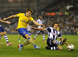 Thomas Eisfeld vs Diego Lugano: A Capital One Cup Battle