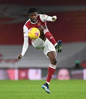 Arsenal v Crystal Palace 2020-21 Collection: Thomas Partey in Action: Empty Emirates Stadium - Arsenal vs. Crystal Palace, Premier League 2021