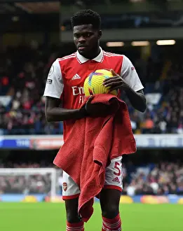 Thomas Partey in Action: A Football Battle at Stamford Bridge - Chelsea vs. Arsenal, Premier League 2022-23