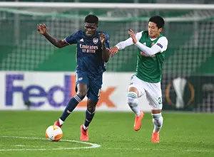 Thomas Partey Breaks Past Rapid Wien's Koya Kitagawa in Arsenal's UEFA Europa League Clash