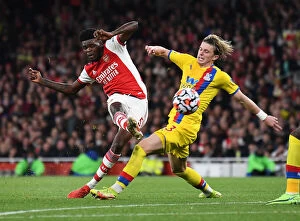 Images Dated 18th October 2021: Thomas Partey Faces Pressure from Conor Gallagher in Arsenal vs Crystal Palace Premier League Clash