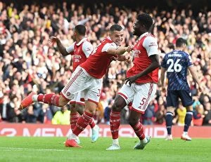 Arsenal v Nottingham Forest 2022-23 Collection: Thomas Partey and Granit Xhaka Celebrate Arsenal's Fourth Goal vs. Nottingham Forest (2022-23)
