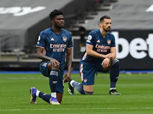 Thomas Partey Kneels: Arsenal vs. West Ham United in Premier League Action