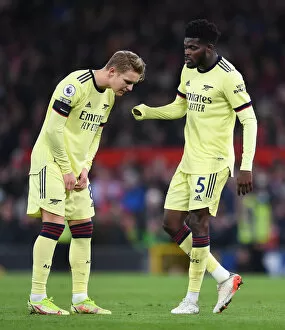 Manchester United v Arsenal 2020-21 Collection: Thomas Partey and Martin Odegaard: Arsenal's Midfield Duo in Action against Manchester United