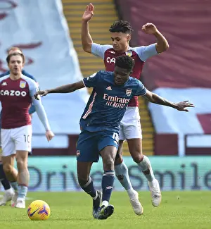 Thomas Partey vs. Ollie Watkins: A Battle at Villa Park in Empty Premier League Stadiums (Aston Villa v Arsenal, 2021)