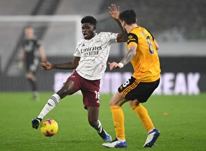 Wolverhampton Wanderers v Arsenal 2020-21 Collection: Thomas Partey vs. Ruben Neves: Battle in the Midfield - Wolverhampton Wanderers vs