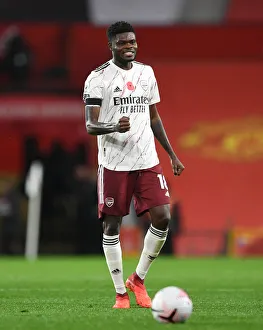 Thomas Partey's Celebration: Arsenal's Victory at Old Trafford in the 2020-21 Premier League (Behind Closed Doors)