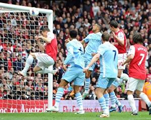 Thomas Vermaelen accidentally blocks Robin van Persie (Arsenal) goal bound header