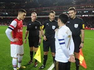 Arsenal v Swansea - FA Cup 3rd Rd Replay 2012-13 Collection: Thomas Vermaelen (Arsenal) Leon Britton (Swansea) with the officials. Arsenal 1: 0 Swansea City