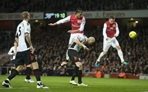 Arsenal V Fulham 2011-12 Prints: Thomas Vermaelen heads past ther Fulham defence to score the Arsenal goal during the Barclays Premier League match