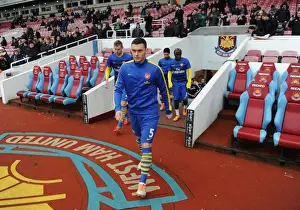 West Ham United V Arsenal 2013-14 Prints: Thomas Vermaelen Leads Arsenal in Pre-Match Warm-Up vs. West Ham United (2013-14)
