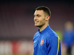 Napoli V Arsenal 2013-14 Prints: Thomas Vermaelen at Napoli's Stadio San Paolo during Arsenal's UEFA Champions League Match (2013)