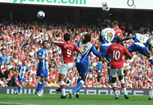 Arsenal V Wigan Athletic 2009-10 Prints: Thomas Vermaelen outjumps Titus Bramble to score the 1st Arsenal goal