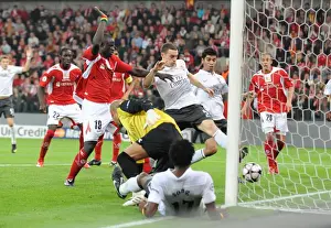 Standard Liege V Arsenal 2009-10 Prints: Thomas Vermaelen shoots past Liege goalkeeper Sinan