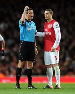 Images Dated 16th April 2012: Thomas Vermaelen vs. Andre Marriner: A Clash at the Emirates