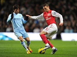 Images Dated 18th December 2011: Thomas Vermaelen vs. David Silva: Clash of the Titans - Manchester City vs