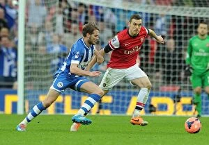 Images Dated 12th April 2014: Thomas Vermaelen vs. Nick Powell: A FA Cup Semi-Final Battle at Wembley Stadium
