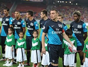 Images Dated 13th July 2011: Thomas Vermaelen's Unstoppable Performance: Arsenal's 4-0 Victory Over Malaysia XI