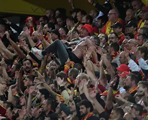RC Lens V Arsenal 2023-24 Prints: Thrilling Champions League Moment: RC Lens Fan's Epic Crowd Surfing Amidst the Tension vs