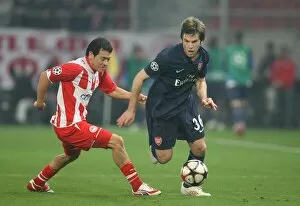 Images Dated 9th December 2009: Tom Cruise (Arsenal) Luciano Galletti (Olympiacos). Olympiacos 1: 0 Arsenal