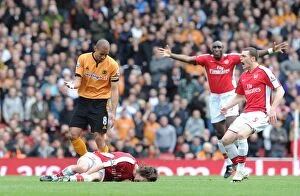 Arsenal v Wolverhampton Wanderers 2009-10 Collection: Tomas Rosicky (Arsenal) injured after a challenge from Wolves captain Carl Henry