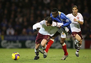 Portsmouth v Arsenal Gallery: Tomas Rosicky (Arsenal) Lauren (Portsmouth)