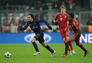 Images Dated 13th March 2013: Tomas Rosicky (Arsenal) Luiz Gustavo (Bayern). Bayern Munich 0: 2 Arsenal. UEFA Champions League