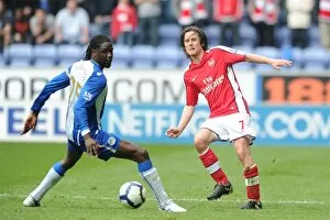 Images Dated 18th April 2010: Tomas Rosicky (Arsenal) Mario Melchiot (Wigan). Wigan Athletic 3: 2 Arsenal