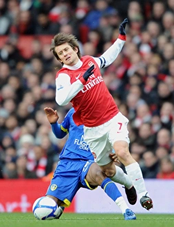 Images Dated 8th January 2011: Tomas Rosicky (Arsenal) Sanchez Watt (Leeds). Arsenal 1: 1 Leeds United