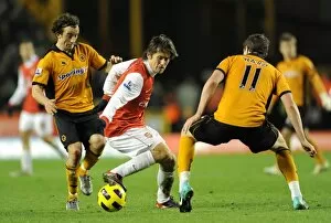 Wolverhampton Wanderers v Arsenal 2010-11 Collection: Tomas Rosicky (Arsenal) Stephen Hunt and Stephen Ward (Wolves). Wolverhampton Wanderers 0