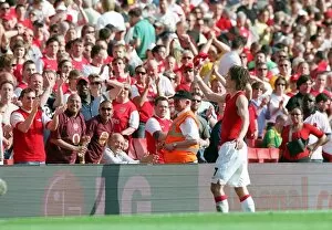 Images Dated 16th April 2007: Tomas Rosicky (Arsenal) throws his shirt to the fans after the match