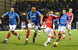 Portsmouth v Arsenal 2009-10 Collection: Tomas Rosicky (Arsenal) Younes Kaboul (Portsmouth). Portsmouth 1: 4 Arsenal